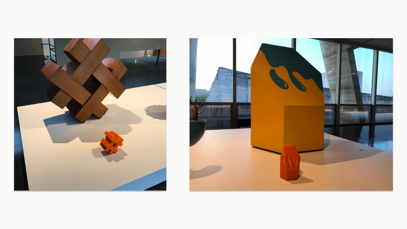 Photo of the original sculptures with their replica by their side